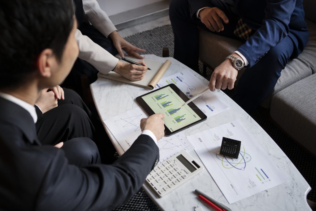 business people working on the ipad and discuss Financial IT Solutions